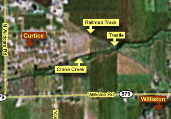 This image is a Google Earth view showing Williston Road to the south, Curtice to the left, railroad tracks at the top with the Trestle n the Apex.